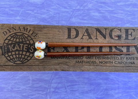 White Ceramic With Color Splashes Brown Hair Sticks